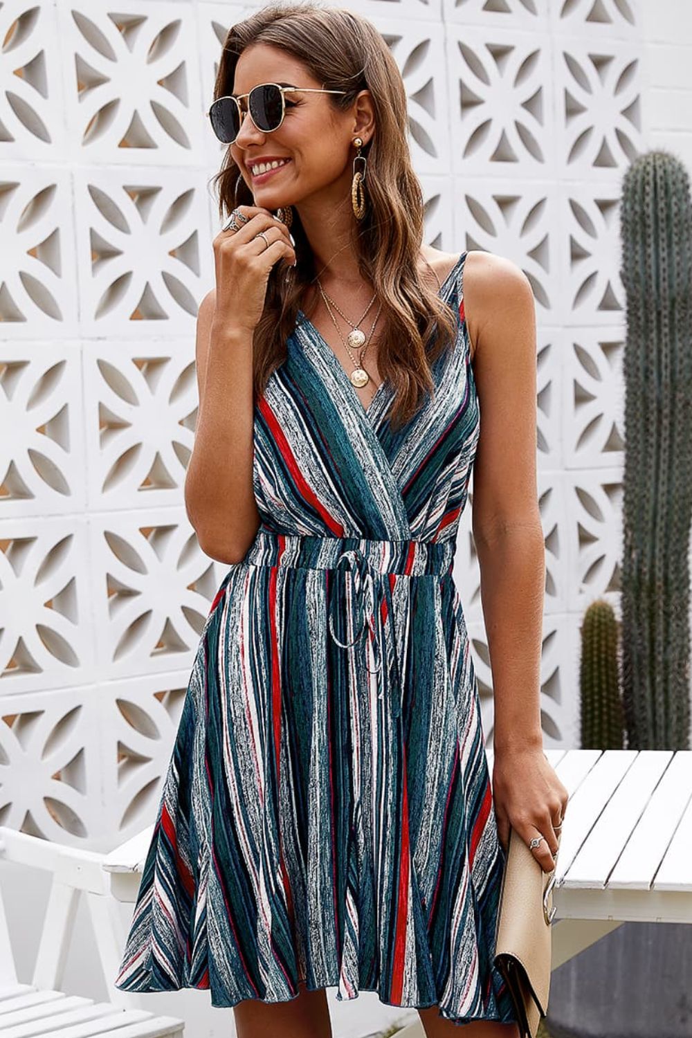 Short, flowy, blue, red, black and white striped spaghetti strap dress.